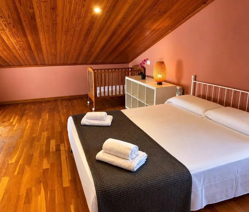 Double bed and a cot in the attic