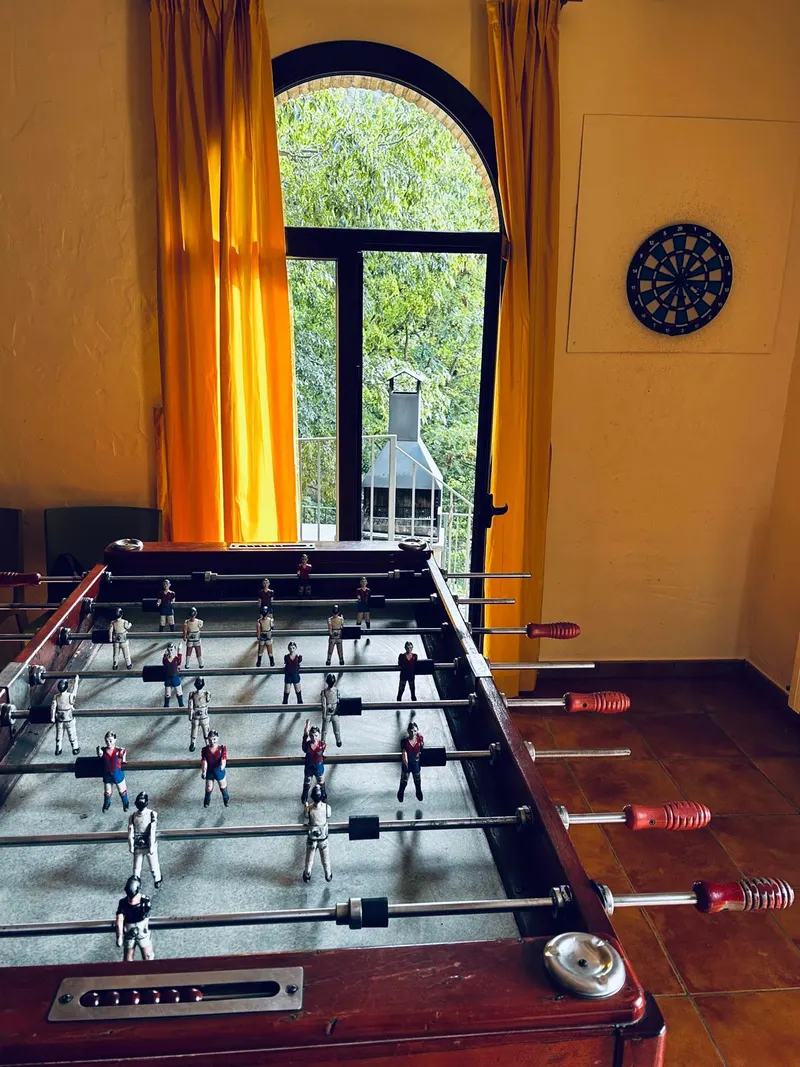 Table football next to an arched window