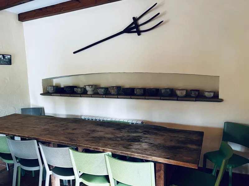 Long wooden table with chairs in the games room