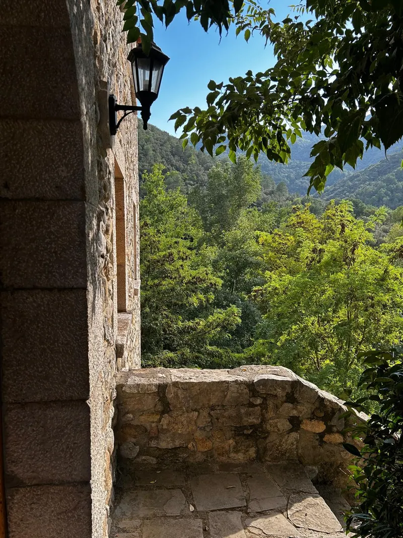 Small stone balcony overlooking the forest and the valley