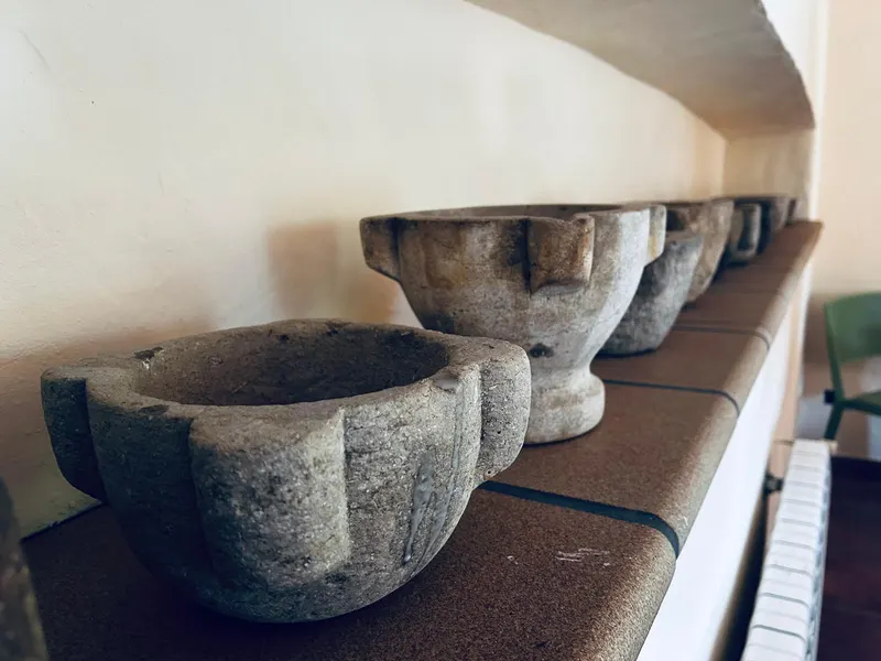 Old stone mortars on a shelf