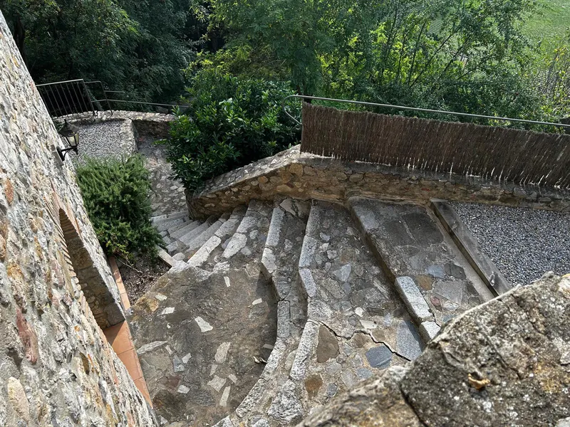 Curving stone stairs leading to the garden