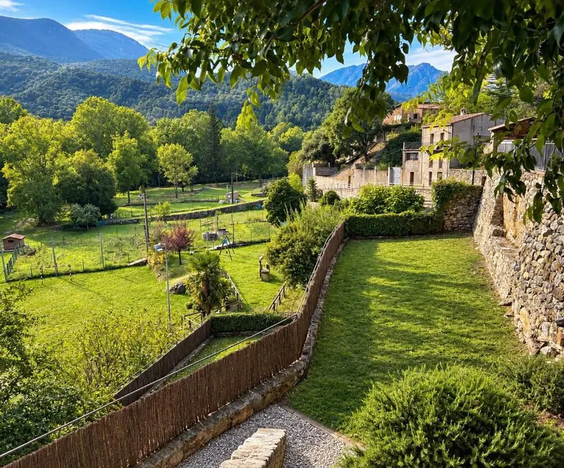 View of the village, meadows and mountains from the garden